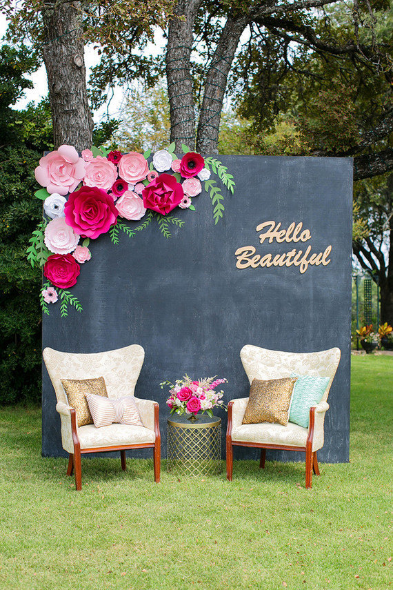 Chalkboard with florals and two chairs for backdrop photobooth